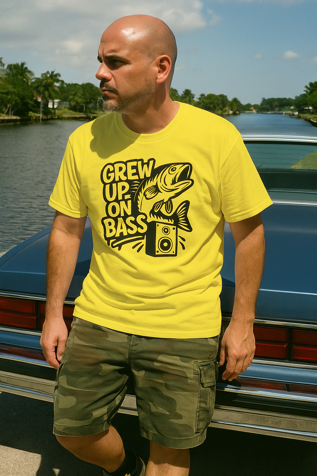 40 year old Cuban man sitting on a 1980 Caprice Classic wearing the Grew Up On Bass tshirt by Made In Dade
