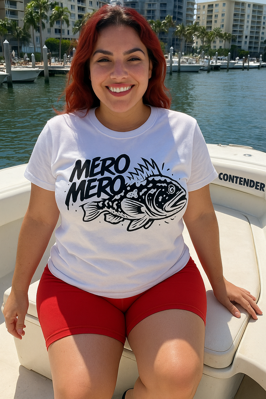 young female in a boat by the dock wearing the mero mero tshirt by made in dade