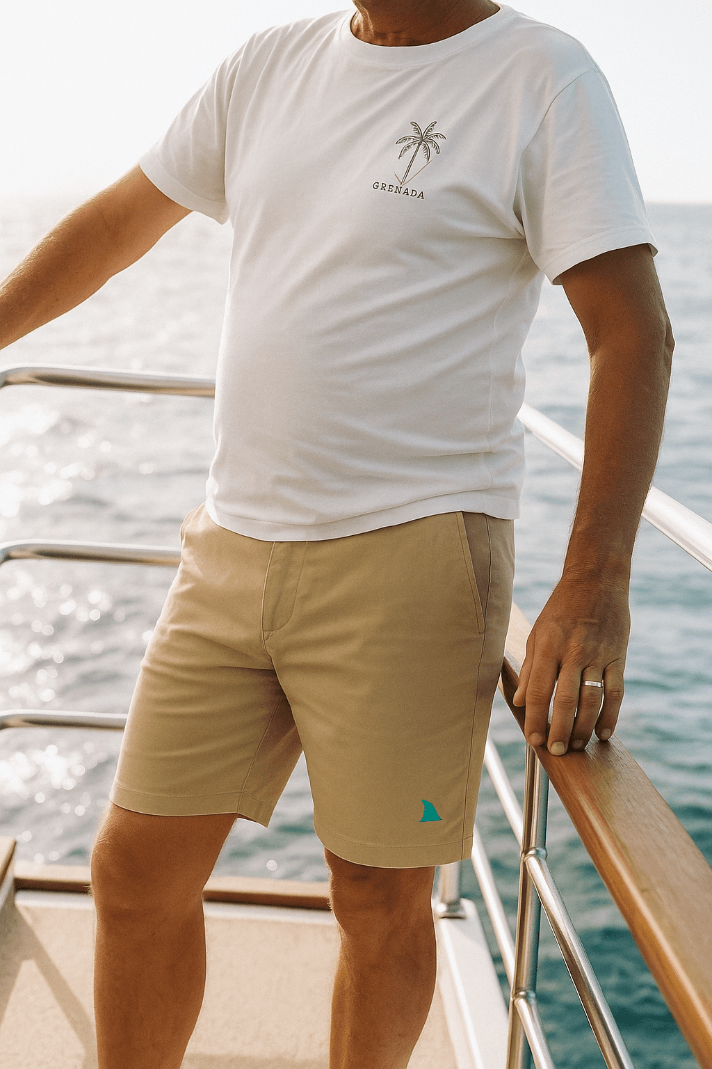 Retired CEO on the second floor deck of his yacht wearing the Sand-colored Hybrid Bay Shorts by Made In Dade